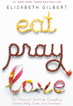  Book cover for Eat, Pray, Love by Elizabeth Gilbert showing a plate with a fork and spoon, symbolizing the journey through Italy, India, and Indonesia